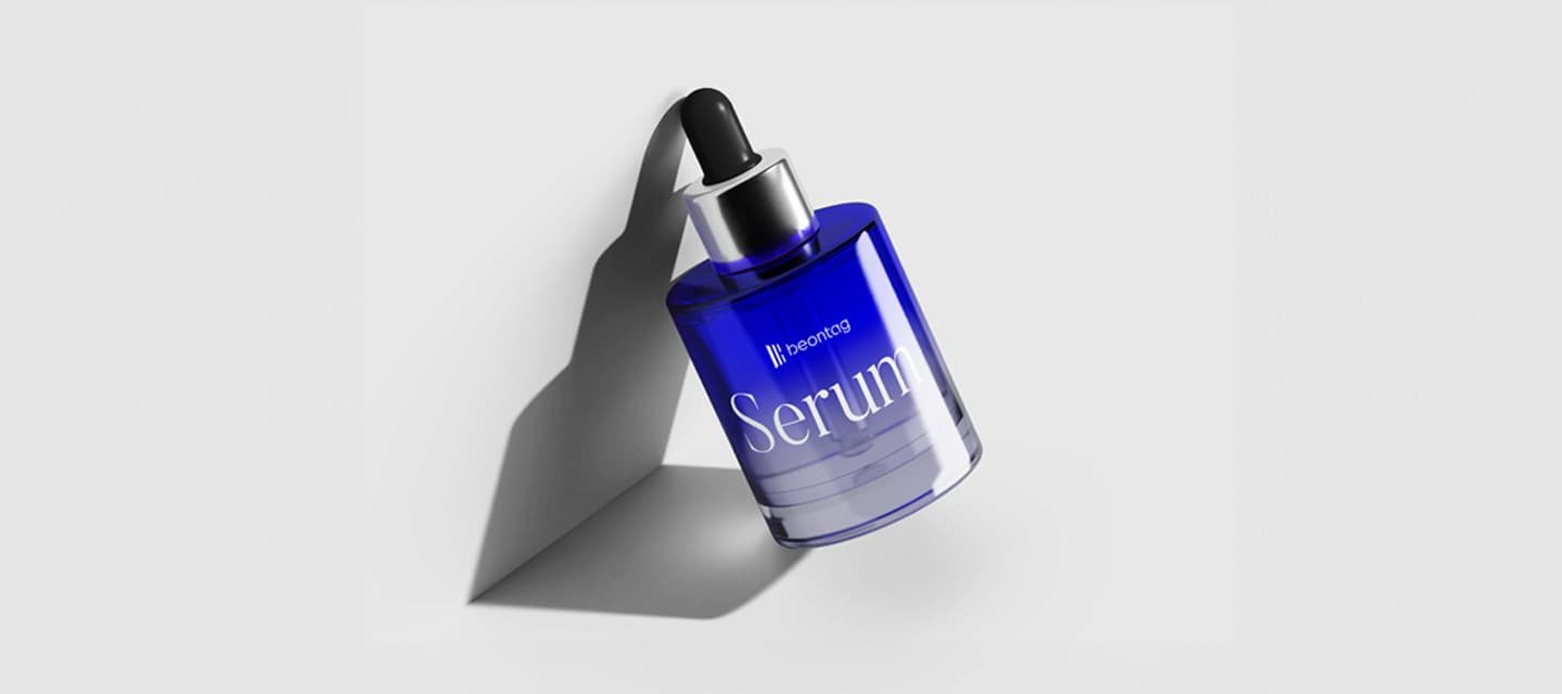 Blue glass serum dropper bottle labeled “beontag Serum” on a light gray background, casting a soft shadow.