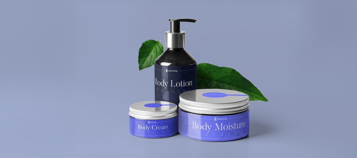 How to choose pressure-sensitive adhesive: labeled body lotion bottle and skincare jars with green leaves on a clean studio background.